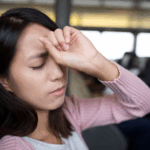 A woman suffers a dizzy spell related to postural orthostatic tachycardia syndrome symptoms.