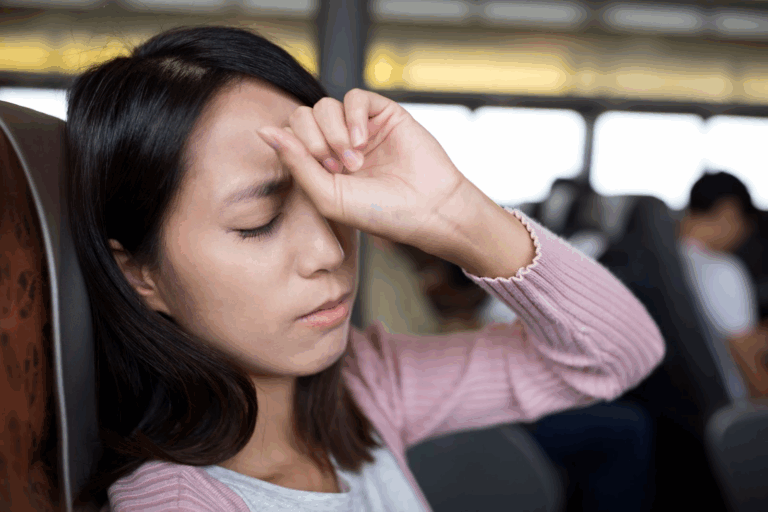 A woman suffers a dizzy spell related to postural orthostatic tachycardia syndrome symptoms.